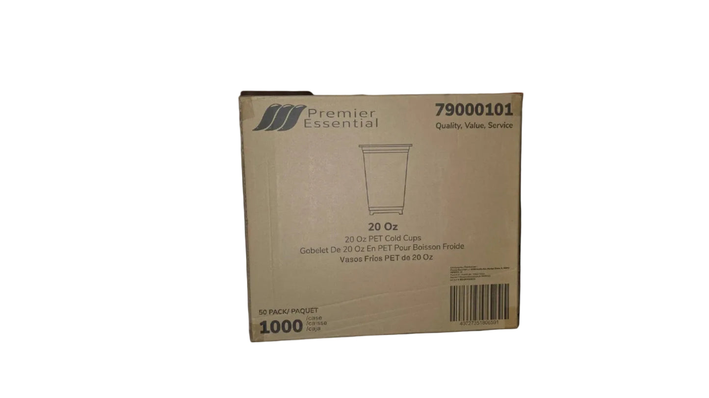 Box of Premier Essential 20 oz cups on a wooden surface with a person's leg and shoes in the background.