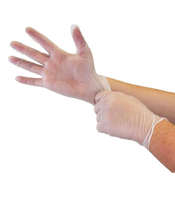 A person wearing a clear vinyl glove, pulling it onto their wrist.